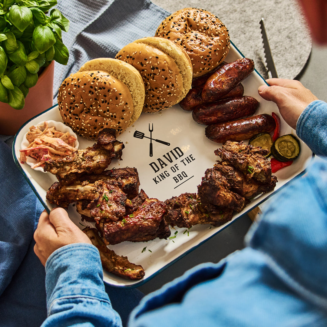 Platter of grilled meats, buns, and sausages with &