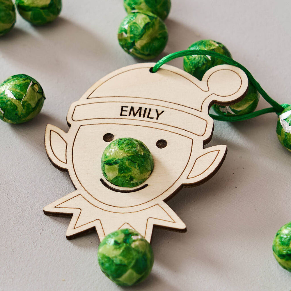 Christmas Elf Decoration And Bag Of Chocolate Noses