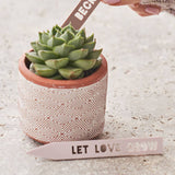 Close up of Message on Personalised Set Of Two Couples Plant Markers